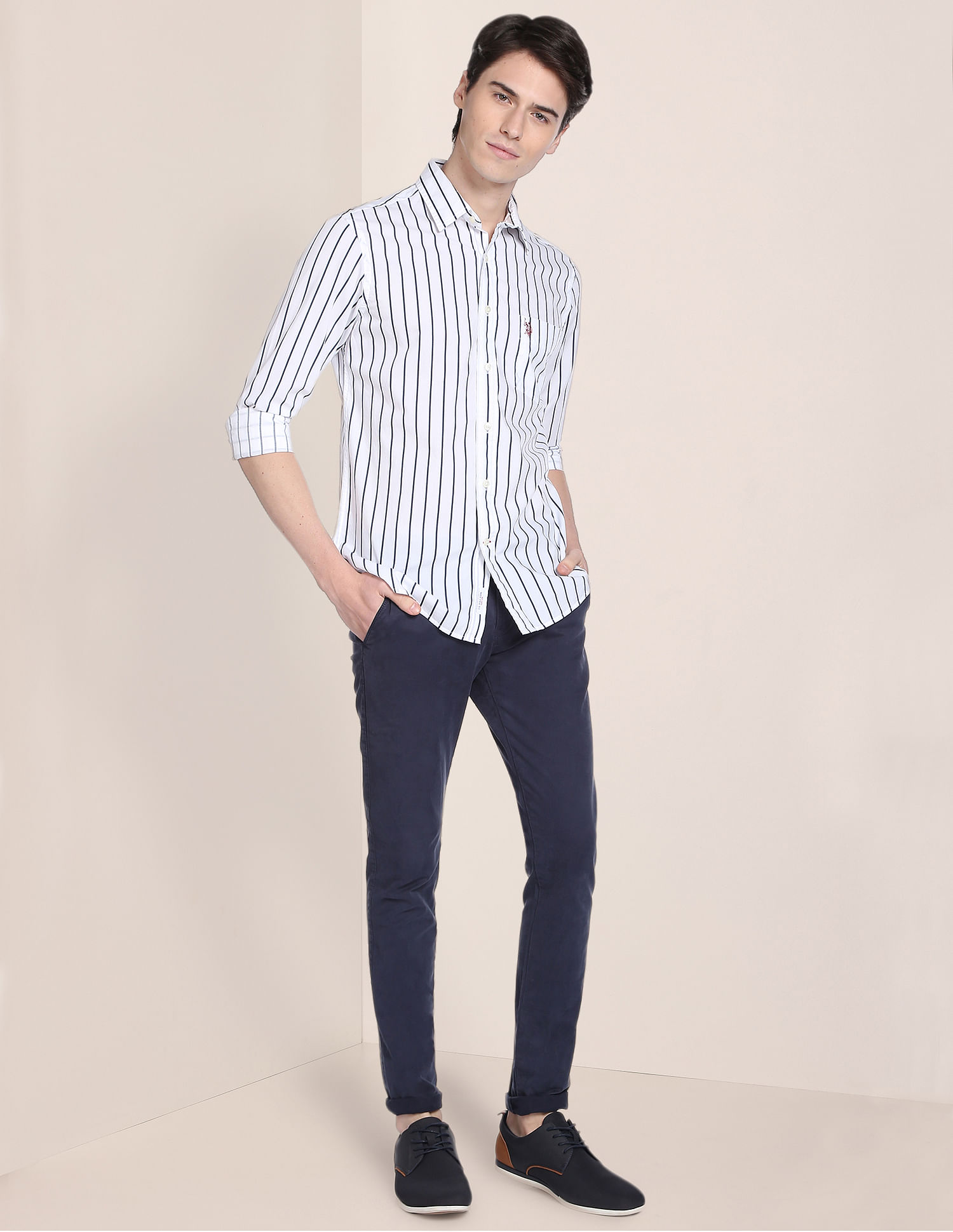 Buy . Polo Assn. This striped shirt is impeccably tailored in a relaxed  profile and has a spread collar and long sleeves with barrel cuffs. -  