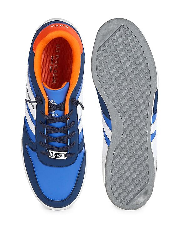 Premium Photo | Sporty blue sneakers pair on orange background, jogging  shoes.