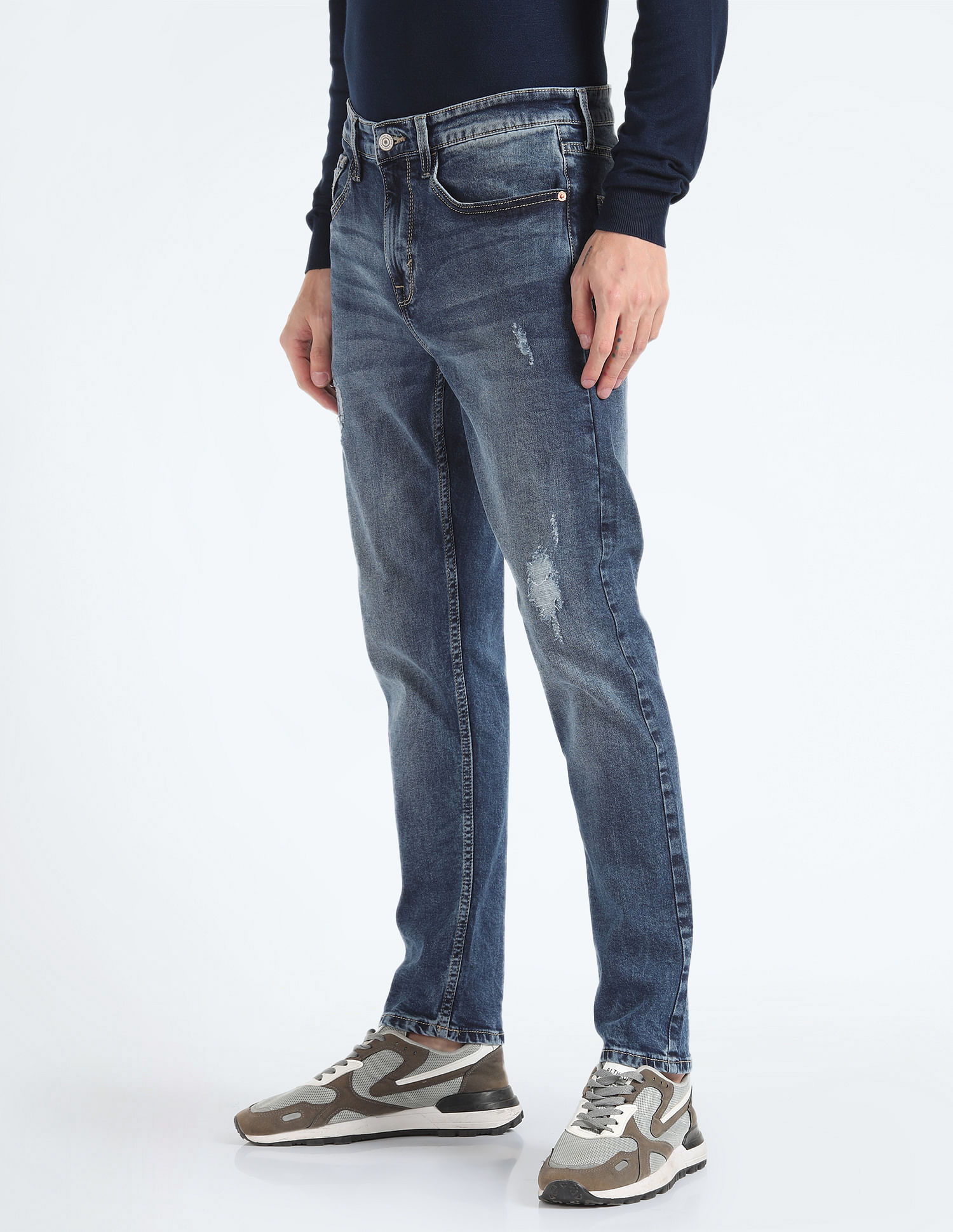 Tapered distressed outlet jeans